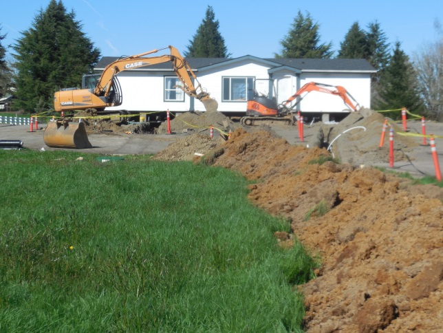 Construction vehicles and temporary building at Station 69