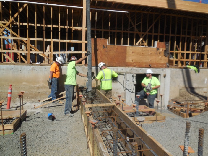 Workers building walls at Station 69