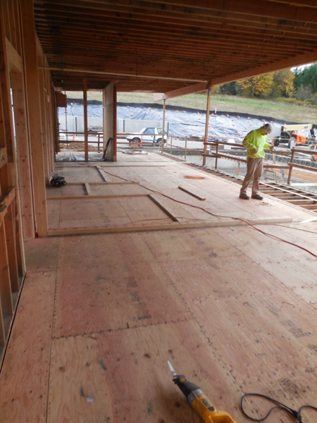 Floor sheathing installation at Station 69