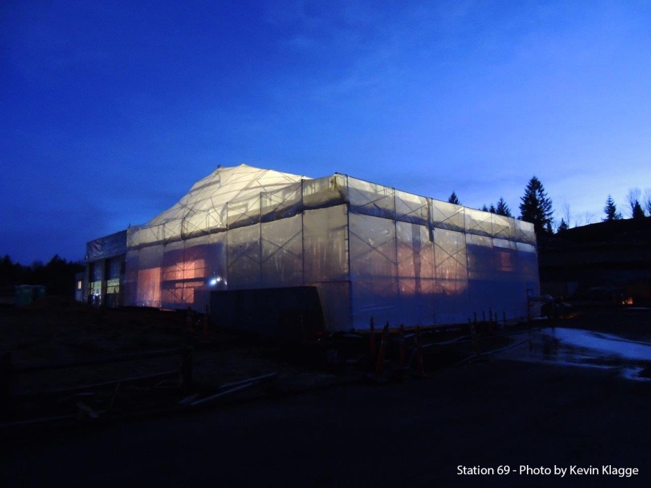 Construction tent at night at Station 69