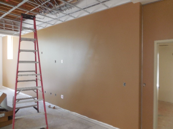 Painting interior walls at Station 64