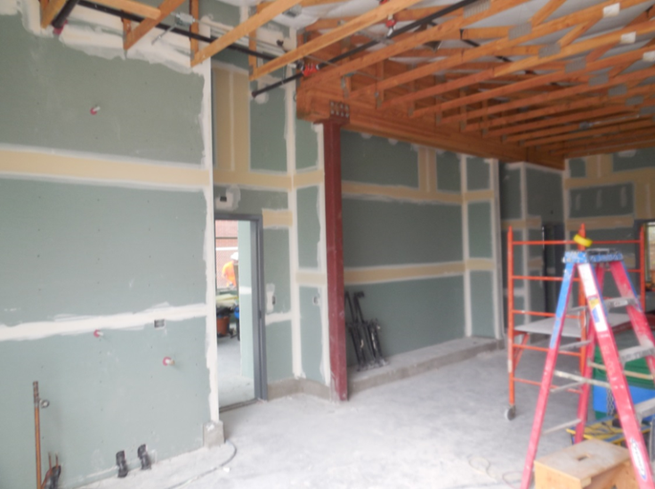 Drywall installation at Station 70