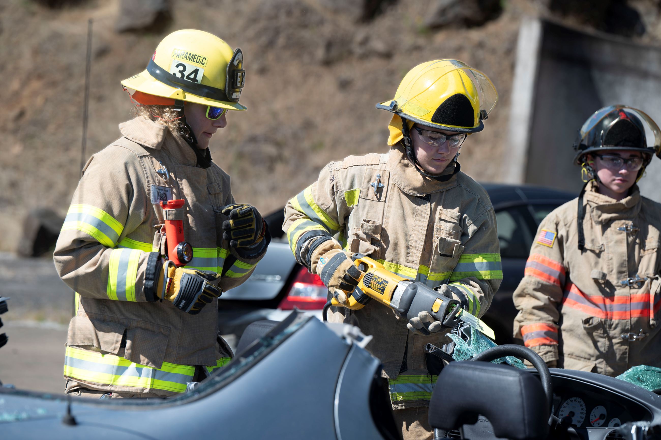 Portland Metro Fire Camp participants use tools for vehicle extrication exercise