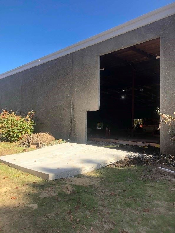 Opening cut in exterior of service center building