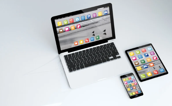 Image of laptop, cell phone, and electronic tablet