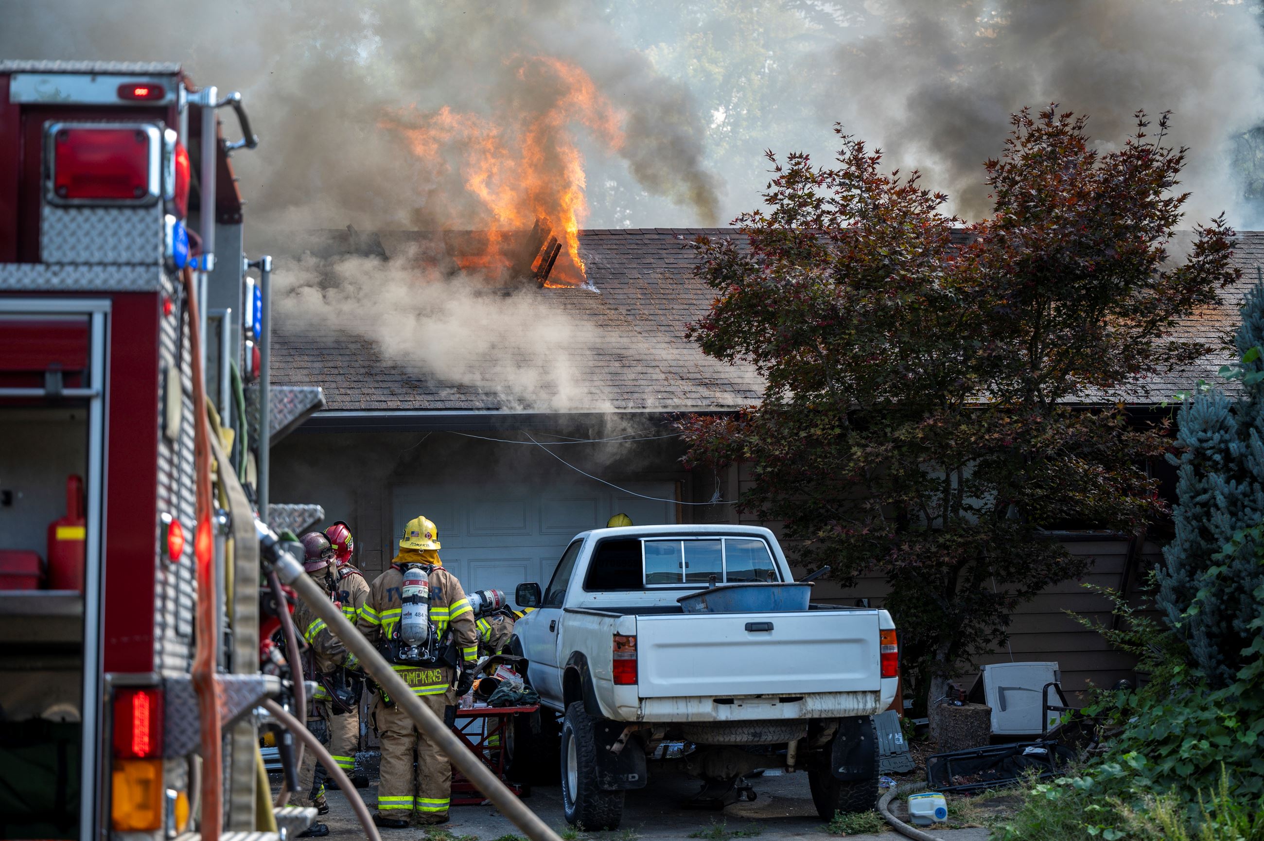 House fire with flames through roof