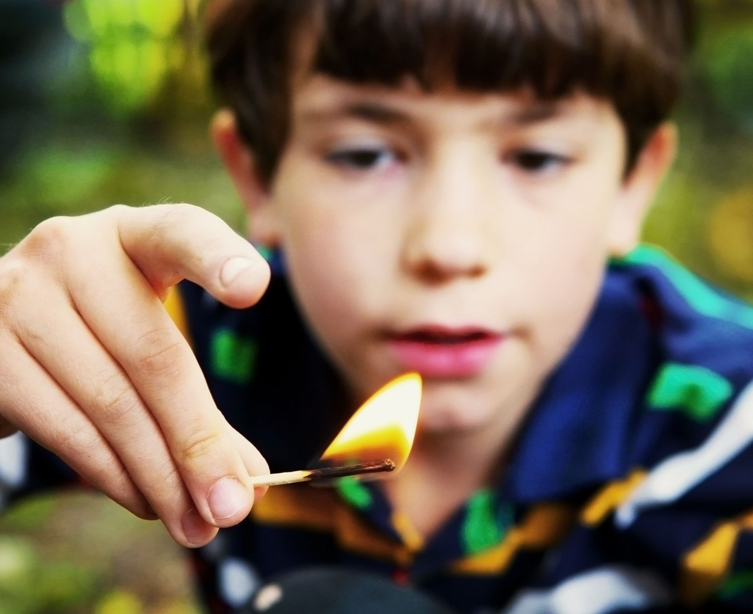 Child with lit match