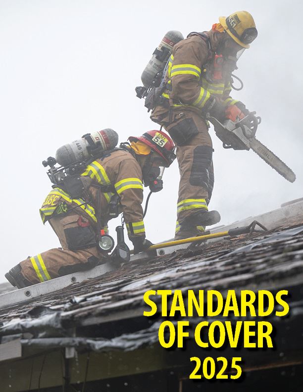 Standards of Cover 2025 with two firefighters and tools ventilating roof